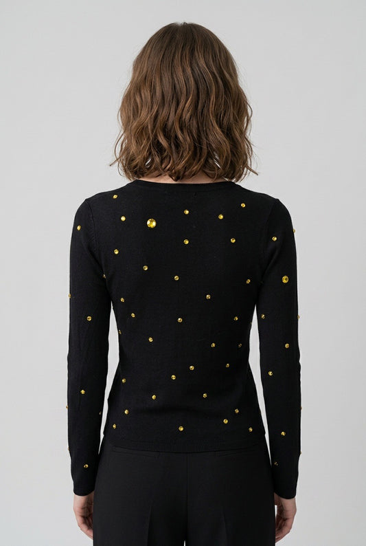 Femme de dos portant un pull Sonia Rykiel x H&M vintage – Seconde main luxe – VestiaireFMR Genève Suisse