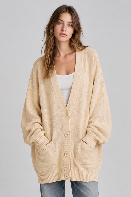 Cardigan Sonia Rykiel crème oversize, col V et poches, porté de face — Seconde Main VestiaireFMR